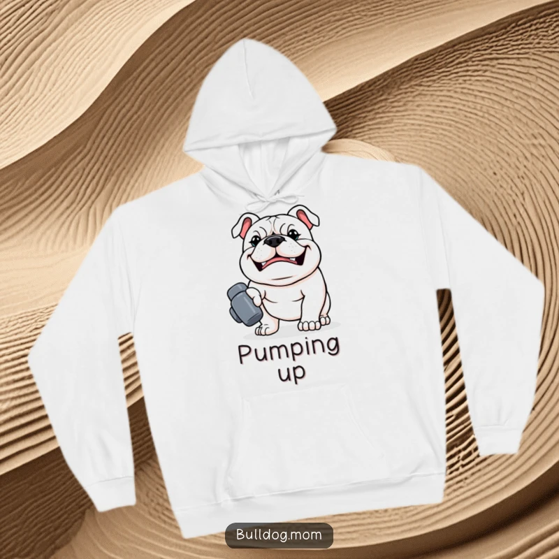 Funny Kawaii Bulldog Hoodie, a strong dog with a determined grin carrying a tiny dumbbell, cozy and motivational dog garment.