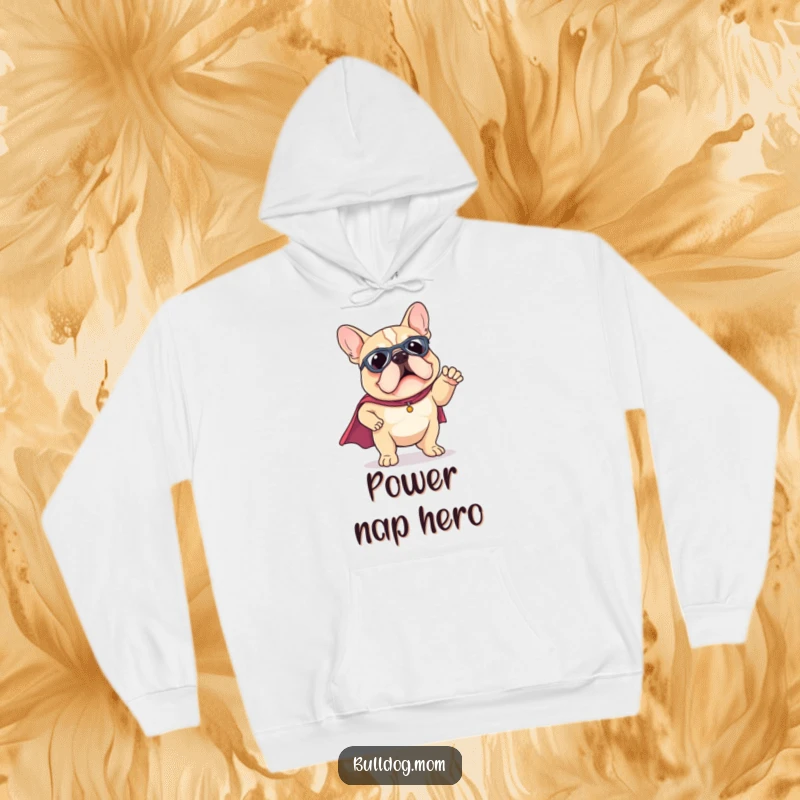 Funny Kawaii Bulldog hoodie wearing a tiny superhero cape, striking a funny pose, offering warmth and heroic spirit.