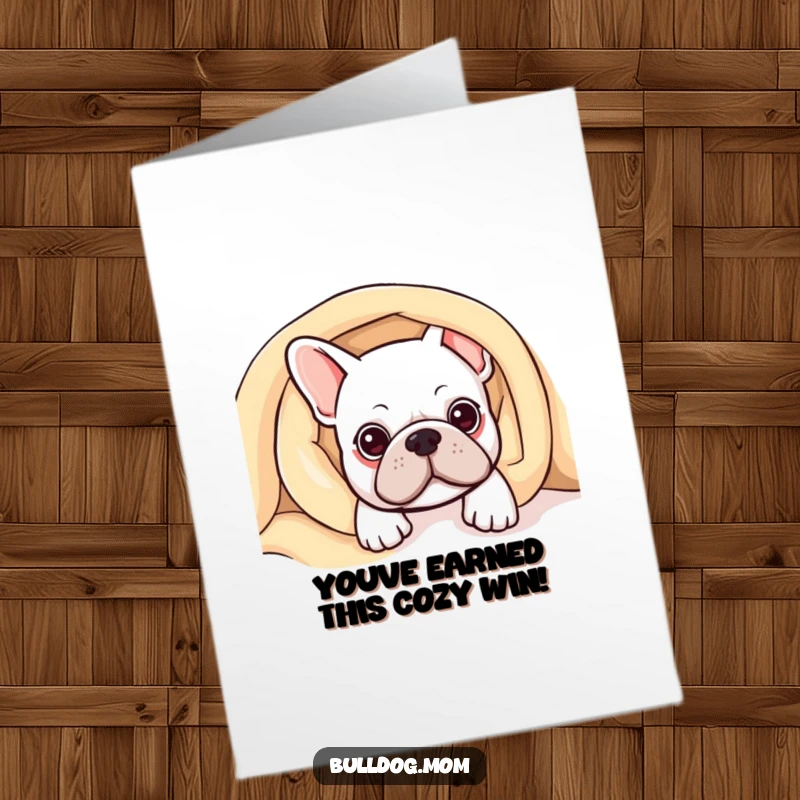 Funny Free Printable congratulations card of a kawaii bulldog peeking from a comfy blanket, offering warm wishes for their achievement. Adorable and thoughtful.