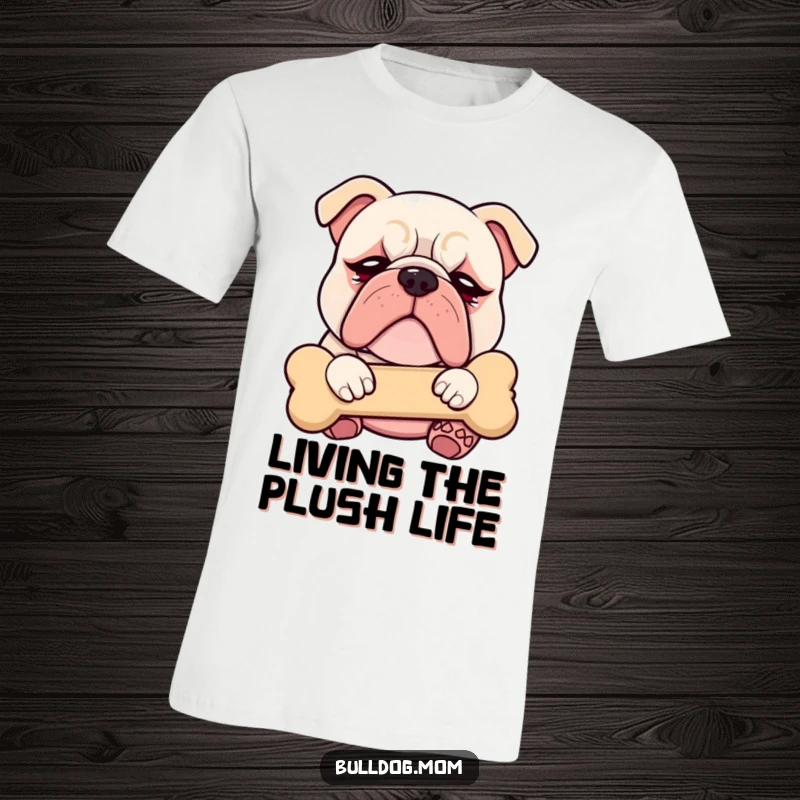 Funny Kawaii Bulldog t-shirt with droopy eyes, blissfully cuddling a plush bone, looking utterly content and sleepy.